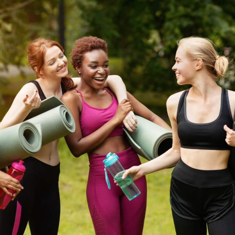 Group of women celebrating with yoga mats at a hen party in Lisbon